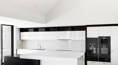 A stepped island is a useful multi-purpose addition architecture, ceiling, daylighting, floor, flooring, house, interior design, kitchen, loft, product design, table, wall, wood flooring, white