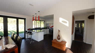 This home is built by Fowler Homes Taranaki floor, flooring, house, interior design, living room, property, real estate, room, gray, black