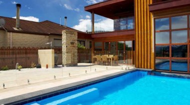 This pool by Mayfair Pools laps against the estate, home, house, leisure, leisure centre, property, real estate, sky, swimming pool, villa, water, teal