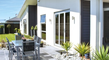 FOWLER HOMES™ specialise exclusively in new home construction backyard, cottage, estate, home, house, outdoor structure, property, real estate, residential area, siding, villa, walkway, window, yard, gray, teal