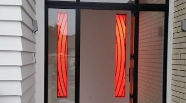 Colourful glass splashbacks create a dynamic backdrop in door, window, gray