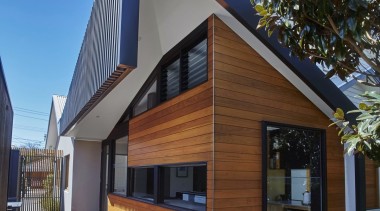 It's a clever take on the typical gable architecture, building, elevation, facade, home, house, property, real estate, residential area, siding, window, brown