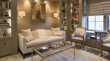 The focus is certainly on the painting in couch, floor, flooring, furniture, home, interior design, living room, room, wall, brown