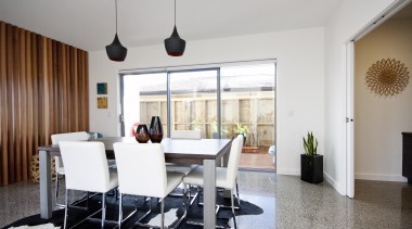 Feature cedar stud hit and miss wall divides apartment, chair, dining room, furniture, interior design, living room, property, real estate, room, table, gray