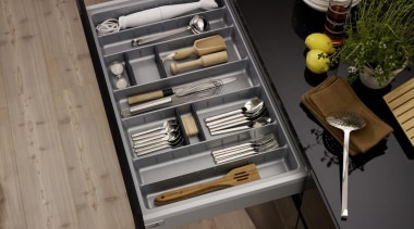 A gentle press on the front panel of drawer, furniture, table, black, gray