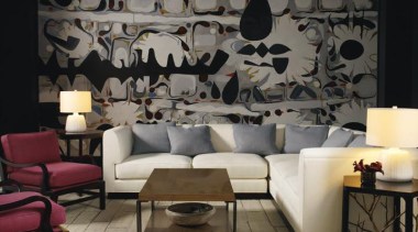 Vintage, antique, and modern pieces creatively express a couch, furniture, interior design, living room, room, table, wall, wallpaper, black, gray