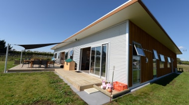 Modern home for family living by Fowler Homes architecture, cottage, facade, home, house, property, real estate, roof, brown, teal