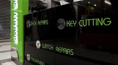 Kiosk services displayed on a glossy black background advertising, green, technology, black, gray