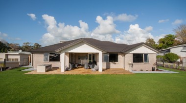 Functional extended roof facilitates a loggia for outdoor backyard, cottage, elevation, estate, facade, farmhouse, grass, home, house, land lot, landscape, lawn, property, real estate, residential area, roof, siding, suburb, yard, brown