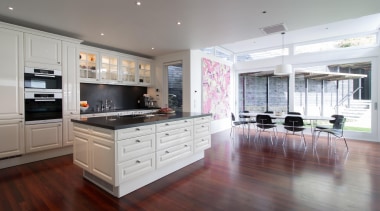 Contemporary technology is combined with timeless aesthetics and cabinetry, countertop, cuisine classique, floor, flooring, hardwood, interior design, kitchen, laminate flooring, property, real estate, room, wood flooring, gray