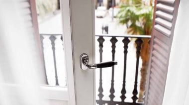 1934, Solid Lever Handle attached to  rose.Bright door, furniture, handrail, home, iron, product, window, white