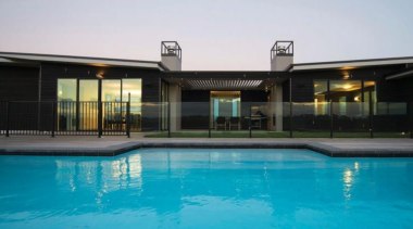 A design by Design House Architecture that focuses estate, facade, home, house, leisure, property, real estate, resort, swimming pool, villa, window, teal, black