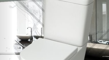 Understated Beauty. Soft lines convey streamlined elegance across bathroom, ceramic, plumbing fixture, product, tap, toilet, toilet seat, white, gray