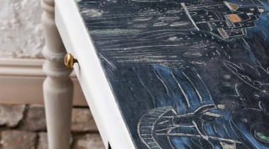 Known to many as the ‘Queen of Paint’, floor, furniture, table, wood, wood stain, black