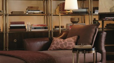 Vintage, antique, and modern pieces creatively express a bookcase, chair, couch, furniture, home, interior design, living room, shelf, shelving, table, wood, brown