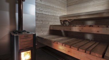 Architect: TYIN tegnestue ArchitectsPhotographer: Pasi Aalto / hearth, wood, black, gray