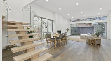 The glass balustrade sandwiches these floating wood steps floor, flooring, house, interior design, laminate flooring, living room, real estate, wood, wood flooring, gray