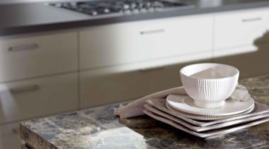 A striking marble pattern distinguished byfragments in varied countertop, floor, flooring, granite, kitchen, gray, white