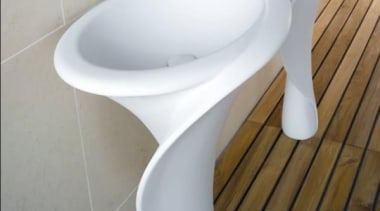 Resembling the shape of the Calla lilly, the bathroom sink, ceramic, plumbing fixture, product, product design, sink, tap, toilet, toilet seat, gray, white