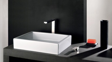 With its iconic rectangular shape, the Rettangolo collection bathroom, bathroom sink, plumbing fixture, product, product design, sink, tap, black, white