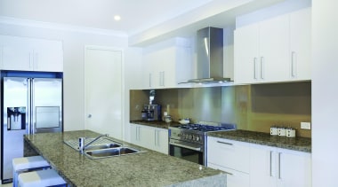 Mediterranean brings warmth to a space by contrasting countertop, interior design, kitchen, property, real estate, room, white