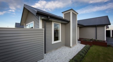 Running the fence in line with the house building, cottage, elevation, estate, facade, home, house, property, real estate, residential area, roof, siding, window, gray