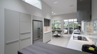 This spacious kitchen brims with generous bench space countertop, floor, interior design, kitchen, real estate, gray