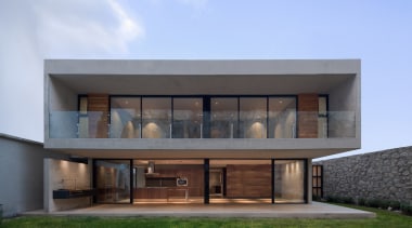 The home an almost fortress-like feel, with stone architecture, building, elevation, estate, facade, home, house, property, real estate, window, teal