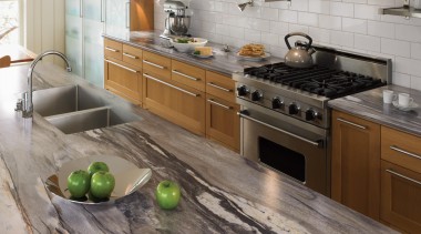 Fun and fresh, this large-scale granite pattern recalls cabinetry, countertop, cuisine classique, floor, flooring, hardwood, interior design, kitchen, wood flooring, gray, brown