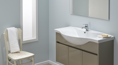 A classic style is formed when sweeping edges angle, bathroom, bathroom accessory, bathroom cabinet, bathroom sink, floor, furniture, plumbing fixture, product, product design, sink, tap, gray