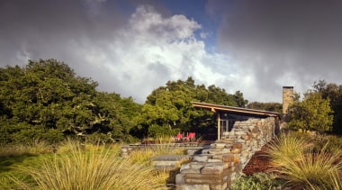 The Halls Ridge Knoll Guest House is the cloud, grass, landscape, meteorological phenomenon, nature, plant, rural area, sky, tree, vegetation, brown, gray