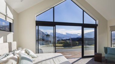 Master suite in this house is positioned for architecture, daylighting, door, estate, home, house, interior design, living room, penthouse apartment, property, real estate, window, gray