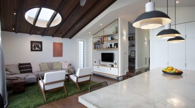 A new addition provides a family living area. ceiling, floor, flooring, house, interior design, living room, loft, real estate, gray