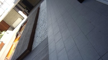 Gem grey exterior courtyard tiles - RAK Gem angle, architecture, building, daylighting, facade, floor, flooring, property, roof, tile, wall, window, wood, gray, black