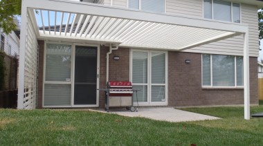 Our beautifully designed 200mm blades look great and backyard, facade, home, house, outdoor structure, porch, property, real estate, residential area, roof, siding, window, yard, gray