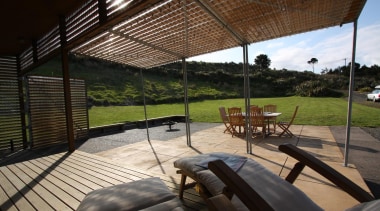 View from the loungers across the terrace to architecture, house, outdoor structure, property, real estate, shade, black