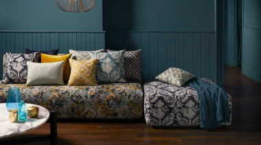 Persian influences and modern interpretations of textured weaves, couch, floor, flooring, furniture, hardwood, home, interior design, living room, room, table, wall, wood, black