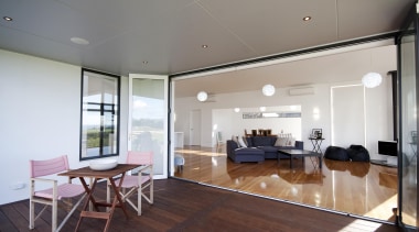 Great indoor /outdoor flow in this home built apartment, ceiling, floor, flooring, house, interior design, living room, property, real estate, room, window, wood, wood flooring, gray