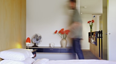 This bedroom features floating end tables - This bed, bedroom, furniture, home, interior design, room, suite, gray, white