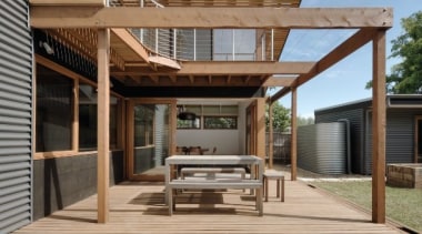 Wood slats line the upper level of this architecture, deck, elevation, facade, house, outdoor structure, real estate, residential area, siding, brown