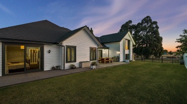 The word that comes to mind when viewing cloud, cottage, elevation, estate, facade, farmhouse, grass, home, house, landscape, property, real estate, residential area, roof, siding, sky, suburb, yard, brown