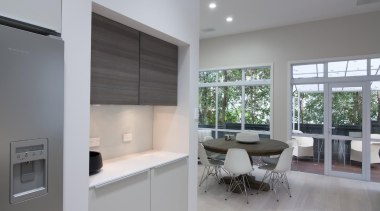 Large windows allow ample light into the kitchen architecture, interior design, kitchen, property, real estate, window, gray