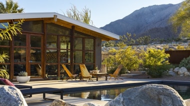 A view of the pool area during the cottage, estate, home, house, landscape, outdoor structure, plant, property, real estate, resort, brown