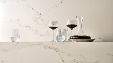 Caesarstone's interpretation of Statuario marble; Statuario Nuvo brings furniture, interior design, lighting accessory, product design, still life photography, table, tap, white