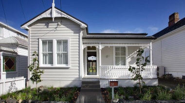 1.	The renovated villa retains its traditional character. building, cottage, estate, facade, home, house, neighbourhood, property, real estate, residential area, siding, window, blue