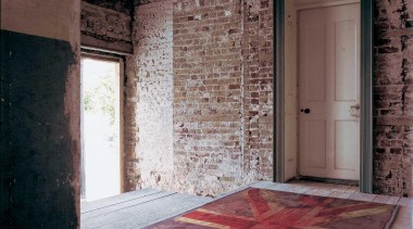 The iconic 'VW Flag' motif was first provocatively architecture, brick, door, floor, flooring, home, house, interior design, structure, wall, window, wood, red, black, gray