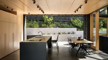 This mid-level kitchen and dining area by Strachan architecture, house, interior design, table, black, Strachan Architects, plywood, stainless steel, Blum, KWC, Tap