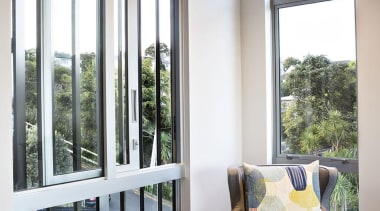 Eastern views are enjoyed from the formal living daylighting, door, estate, home, house, interior design, living room, real estate, sash window, window, white, gray