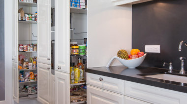 Contemporary technology is combined with timeless aesthetics and cabinetry, countertop, cuisine classique, home appliance, interior design, kitchen, major appliance, refrigerator, room, shelf, shelving, gray