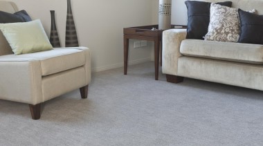 Combines a two-colour thick and thin yarn with carpet, chair, coffee table, floor, flooring, furniture, hardwood, interior design, laminate flooring, living room, loveseat, table, tile, wood, wood flooring, gray